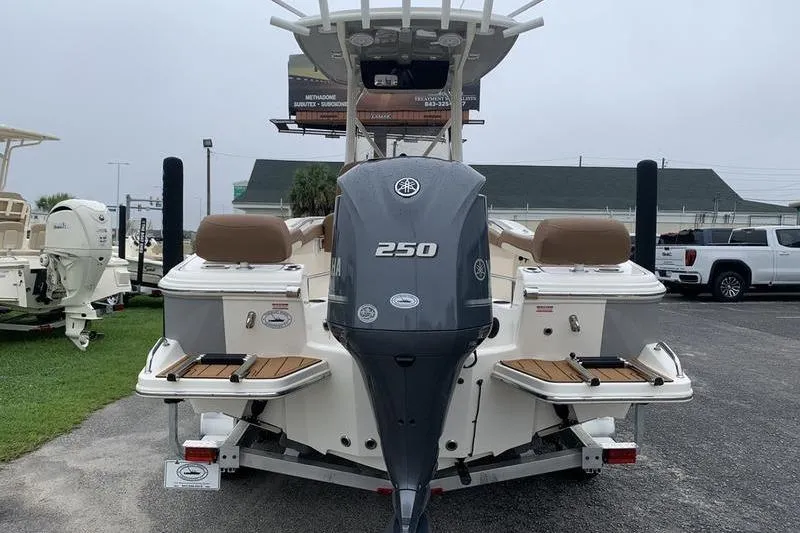 Slide: The Image of 2025 Pionee Sportfish 222 boat with Yamaha 250 engine, rear view in parking lot. - 3