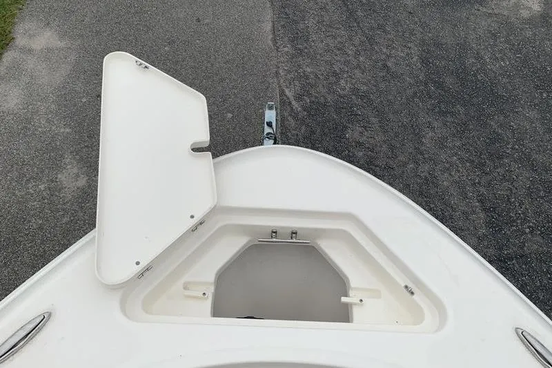 Slide: The Image of Open storage compartment on 2025 Pionee Sportfish 222 boat, viewed from above. - 35