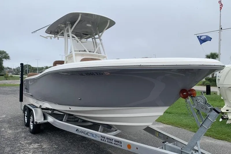 Slide: The Image of 2025 Pionee Sportfish 222 boat on trailer, sleek design, gray hull, ready for adventure. - 6