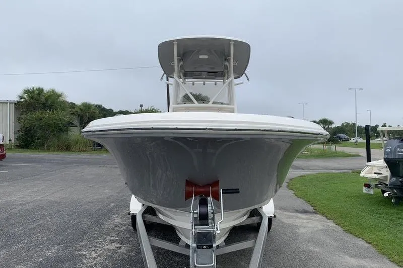 Slide: The Image of 2025 Pionee Sportfish 222 boat on trailer, front view, overcast day. - 7