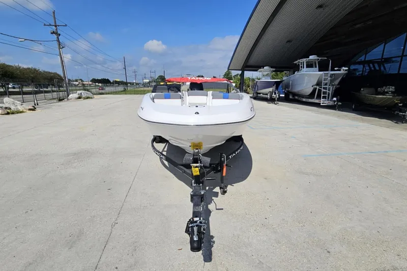 Slide: The Image of 2024 Tahoe T16 boat on trailer in outdoor showroom. - 3