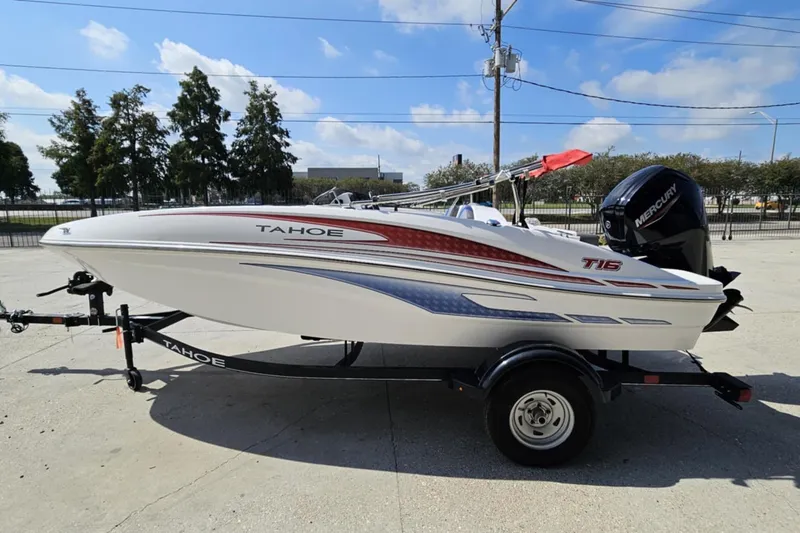 Slide: The Image of 2024 Tahoe T16 boat on trailer, featuring sleek design and Mercury outboard motor. - 5