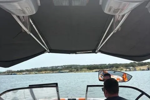 Slide: The Image of Interior view of 2013 Nautique Super Air Nautique G23 boat on a lake. - 16