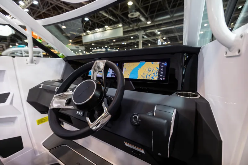 Slide: The Image of 2025 Axopar Sun-Top boat storage compartment with open hatch and visible interior features. - 10