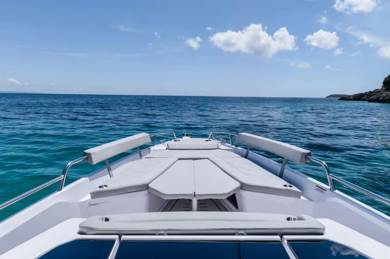 Slide: The Image of 2025 Axopar Sun-Top boat interior with compact toilet and modern design. - 15