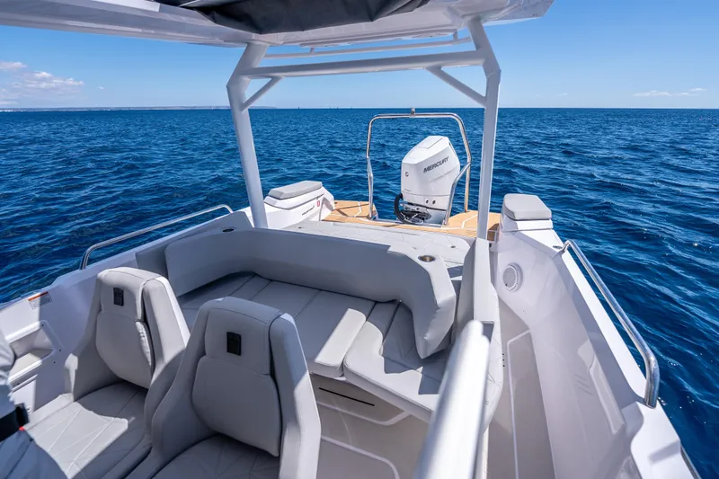 Slide: The Image of 2025 Axopar Sun-Top boat seat with integrated cup holders and modern design. - 18