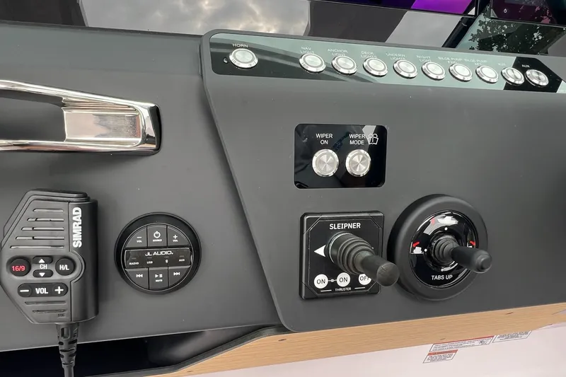 Slide: The Image of Control panel of 2025 Axopar Sun-Top boat with Simrad and JL Audio systems. - 33
