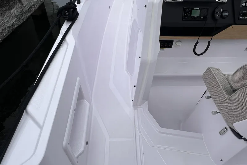 Slide: The Image of 2025 Axopar Sun-Top boat interior with modern controls and seating. - 37