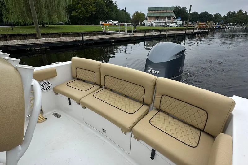 Slide: The Image of 2021 Sportsman Heritage 231 Center Console boat with tan seating and Yamaha 250 engine. - 11