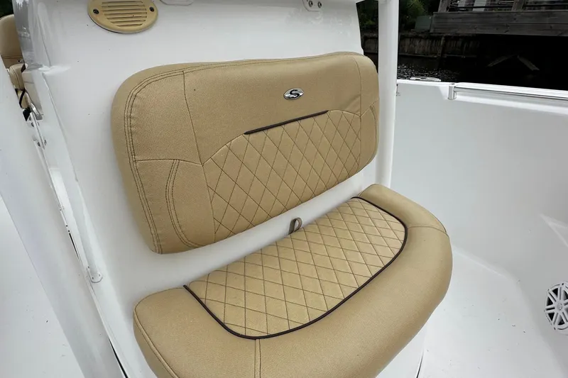 Slide: The Image of 2021 Sportsman Heritage 231 Center Console tan cushioned seat with diamond stitching. - 14