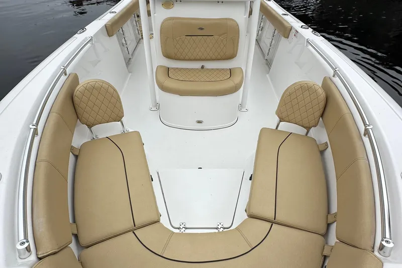 Slide: The Image of 2021 Sportsman Heritage 231 Center Console boat with tan cushioned seating. - 16