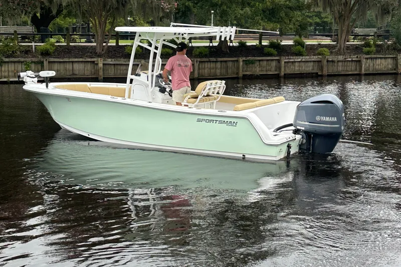 Slide: The Image of 2021 Sportsman Heritage 231 Center Console boat on calm water with Yamaha engine. - 19