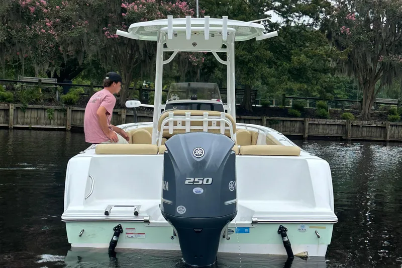 Slide: The Image of 2021 Sportsman Heritage 231 Center Console boat with Yamaha 250 engine on a calm waterway. - 20