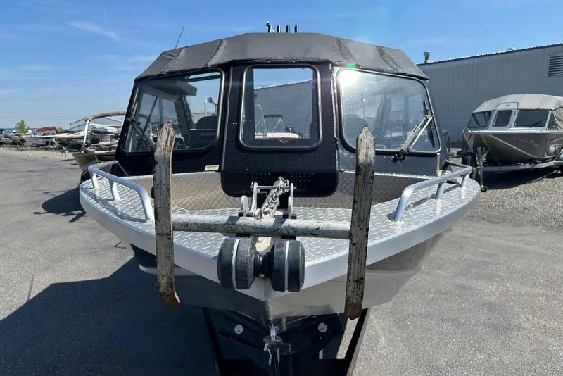 Slide: The Image of 2021 Thunder Jet Skeena Classic Jet boat in a marina, front view. - 2