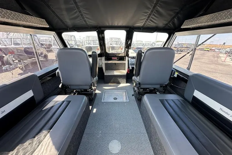 Slide: The Image of Interior of 2021 Thunder Jet Skeena Classic Jet boat, featuring seating and control area. - 5