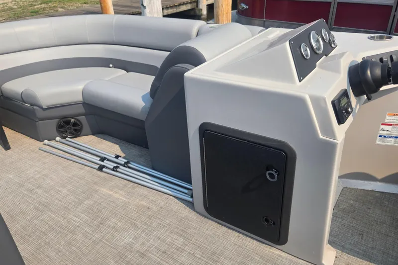 Slide: The Image of 2022 Flagship Pontoon E22CU interior with gray seating and control panel. - 16