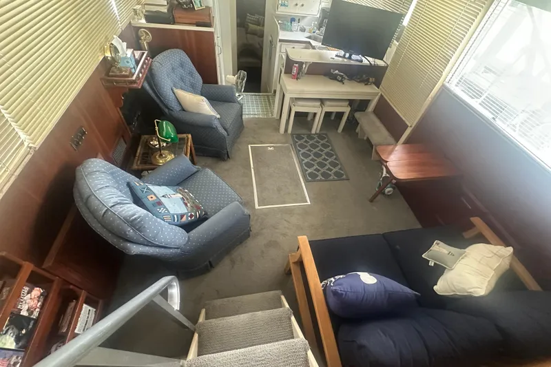 Slide: The Image of 1971 Chris-Craft Commander 42 interior with cozy seating, carpet, and nautical decor. - 21