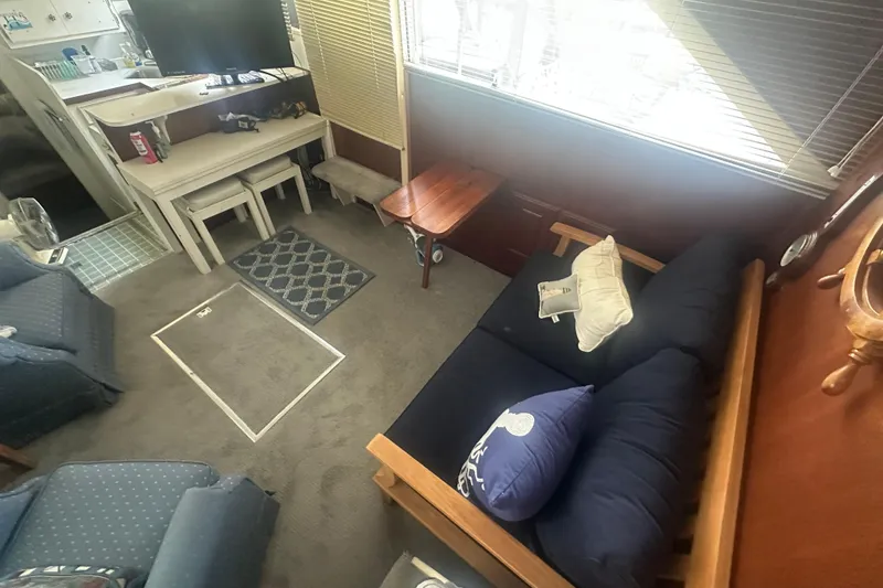 Slide: The Image of Interior of 1971 Chris-Craft Commander 42 with cozy seating and nautical decor. - 22