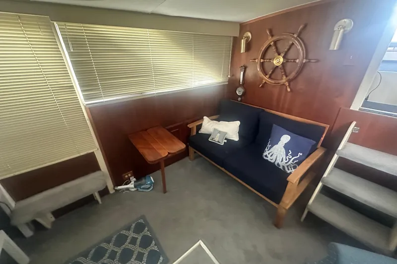 Slide: The Image of Interior of 1971 Chris-Craft Commander 42 with nautical decor and wooden accents. - 24