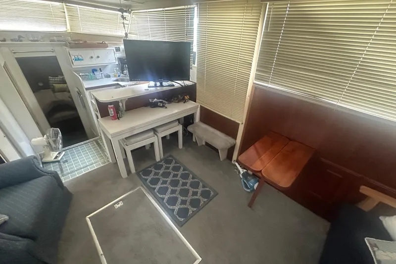 Slide: The Image of Interior of 1971 Chris-Craft Commander 42 with TV, seating, and kitchenette. - 25