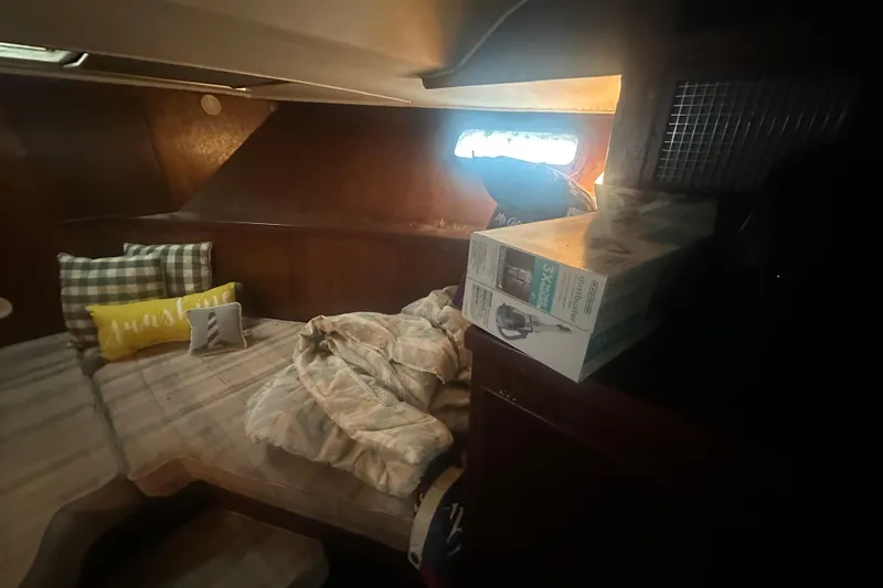 Slide: The Image of Cozy cabin interior of 1971 Chris-Craft Commander 42 with bedding and pillows. - 35