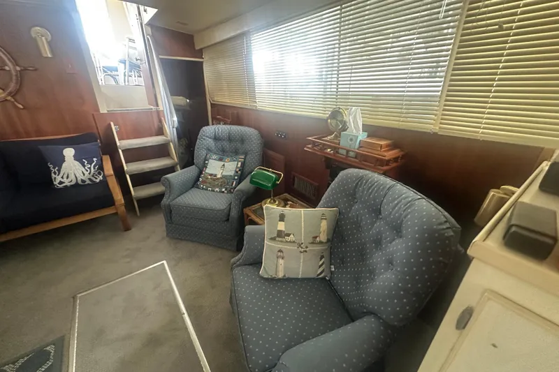 Slide: The Image of 1971 Chris-Craft Commander 42 interior with cozy seating and nautical decor. - 38