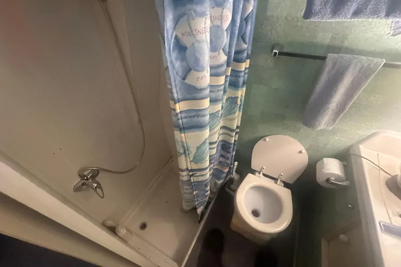 Slide: The Image of Bathroom interior of 1971 Chris-Craft Commander 42 boat with shower and toilet. - 50