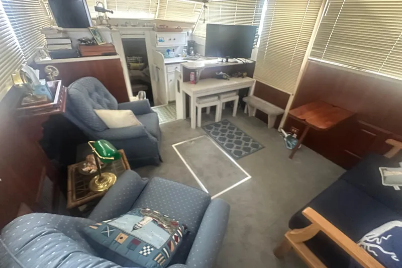 Slide: The Image of Interior of 1971 Chris-Craft Commander 42 with cozy seating and nautical decor. - 54