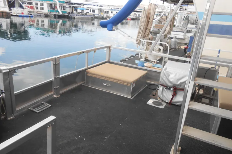 Slide: The Image of 2004 Myacht 4815 houseboat deck with seating, docked at marina. - 10