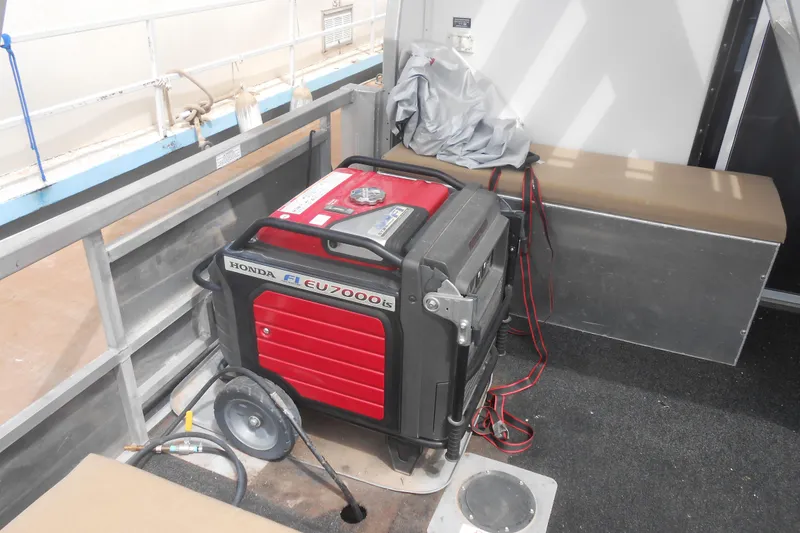 Slide: The Image of Honda EU7000is generator on 2004 Myacht 4815 houseboat deck. - 15