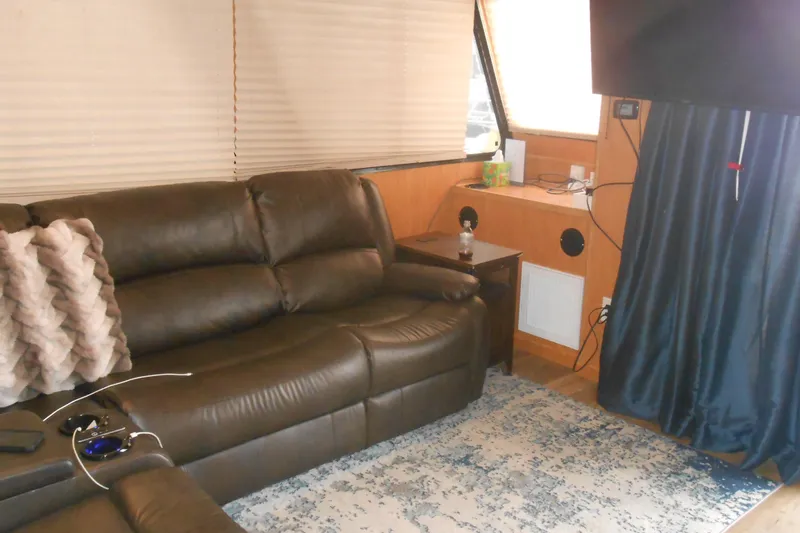 Slide: The Image of Interior of 2004 Myacht 4815 with leather sofa, pillows, and modern decor. - 3