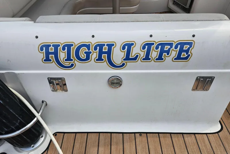Slide: The Image of 1999 Regal Commodore 292 boat with "High Life" text on the stern. - 7