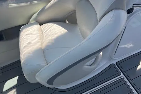 Slide: The Image of 2008 Chaparral 256 SSi boat interior with white leather seating. - 10