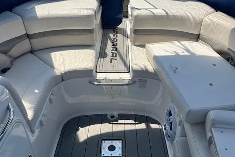 Slide: The Image of 2008 Chaparral 256 SSi boat interior with cushioned seating and deck. - 12