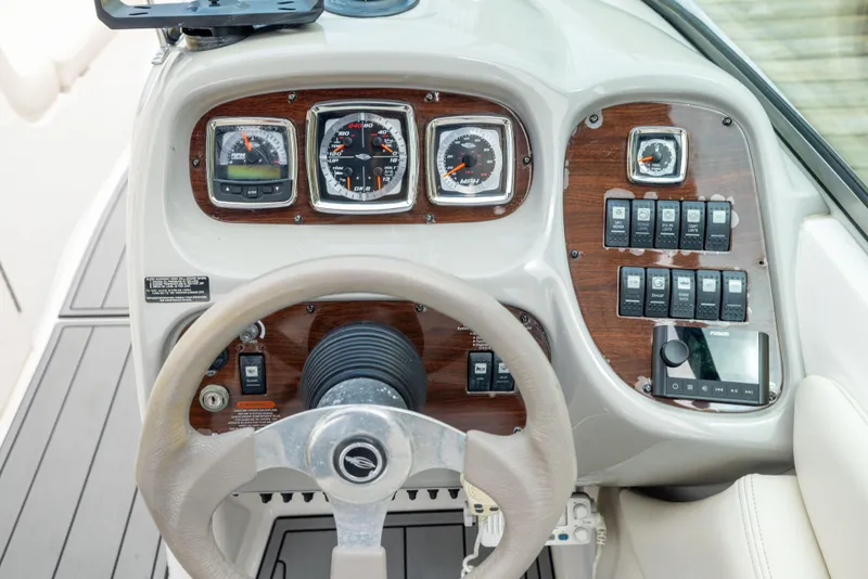 Slide: The Image of Dashboard of a 2008 Chaparral 256 SSi boat with gauges and controls. - 14