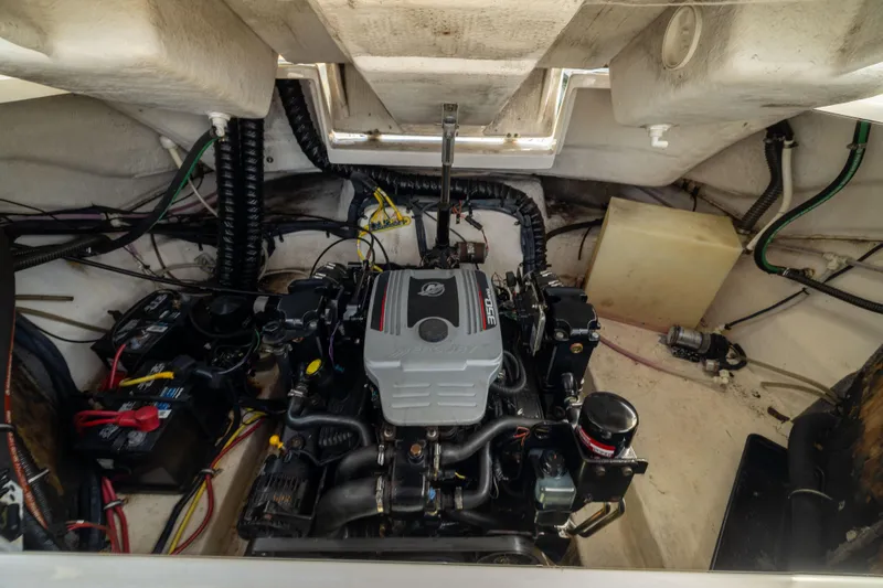 Slide: The Image of Engine compartment of a 2008 Chaparral 256 SSi boat, showcasing mechanical components. - 20