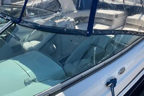 Slide: The Image of 2008 Chaparral 256 SSi boat interior with clear windshield and seating. - 24