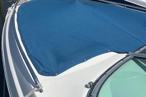 Slide: The Image of 2008 Chaparral 256 SSi boat with blue cover on deck. - 3