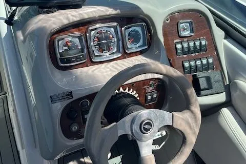 Slide: The Image of 2008 Chaparral 256 SSi boat dashboard with steering wheel and instrument panel. - 5