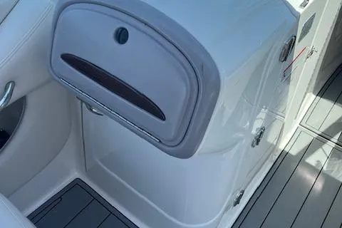 Slide: The Image of 2008 Chaparral 256 SSi boat interior with storage compartment and sleek design. - 7