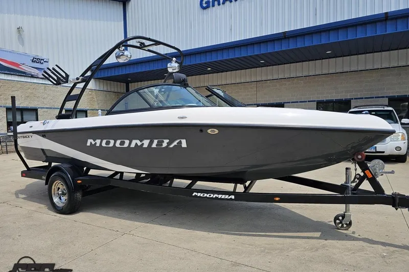 Slide: The Image of 2014 Moomba Outback V boat on trailer, parked outside dealership. - 10