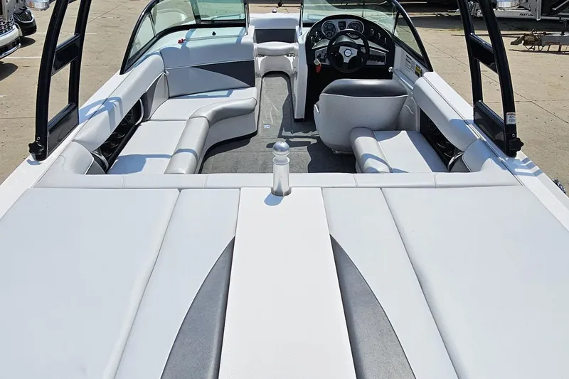 Slide: The Image of 2014 Moomba Outback V boat interior with white seating and steering console. - 36