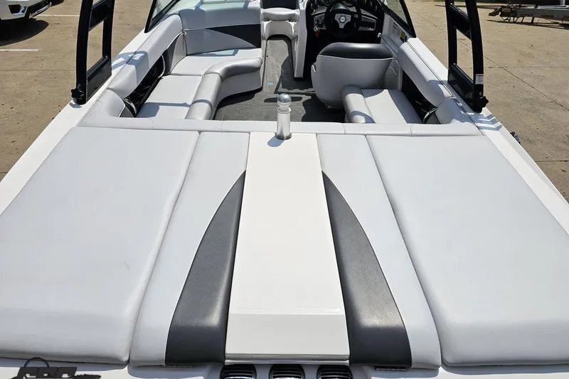 Slide: The Image of 2014 Moomba Outback V boat interior with spacious seating and sleek design. - 37