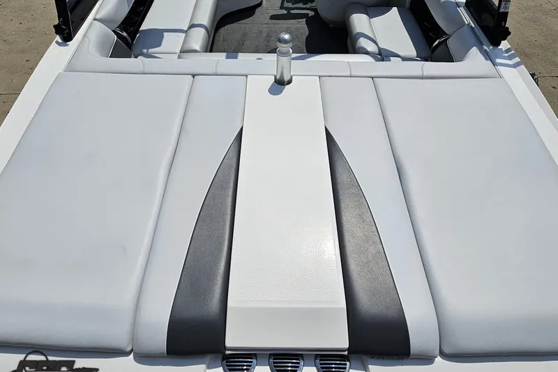 Slide: The Image of 2014 Moomba Outback V boat interior with sleek white and gray upholstery. - 38