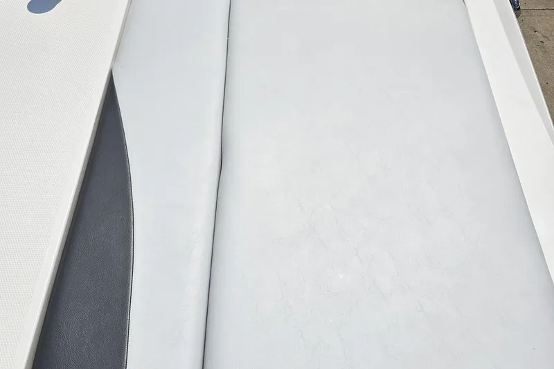 Slide: The Image of 2014 Moomba Outback V boat interior with light gray upholstery detail. - 39