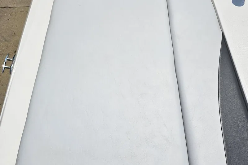 Slide: The Image of 2014 Moomba Outback V boat interior with light gray upholstery detail. - 40