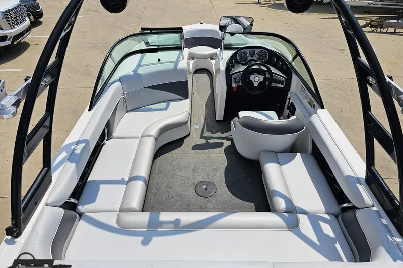 Slide: The Image of 2014 Moomba Outback V boat interior with white seating and steering console. - 43