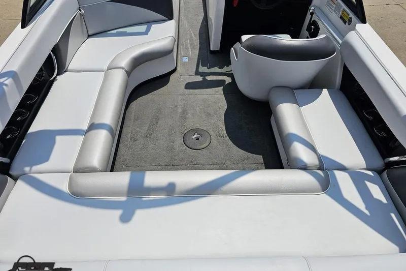 Slide: The Image of 2014 Moomba Outback V interior with gray seating and carpeted floor. - 46