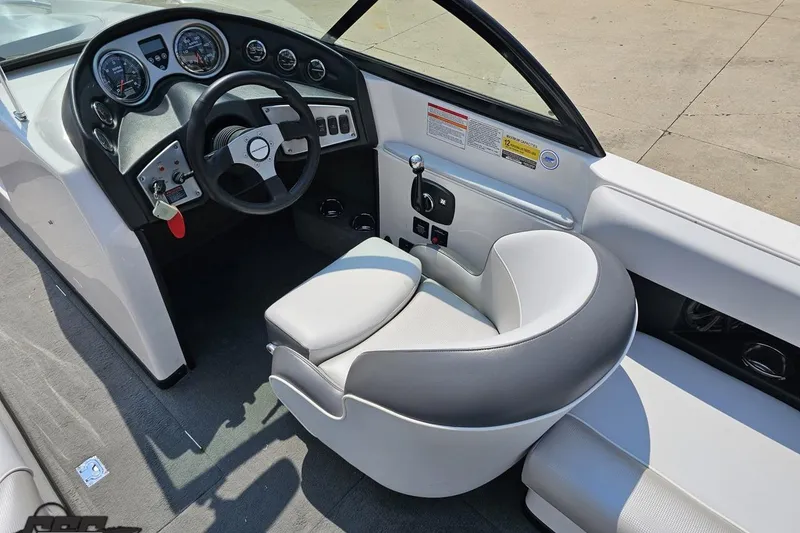 Slide: The Image of 2014 Moomba Outback V boat interior with steering wheel and dashboard controls. - 50