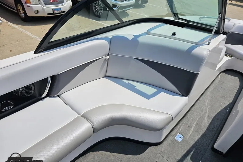 Slide: The Image of 2014 Moomba Outback V boat interior with gray seating and windshield. - 52